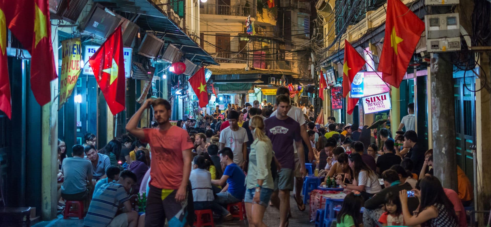Hanoi street food night tour in the Old Quarter with lively evening atmosphere