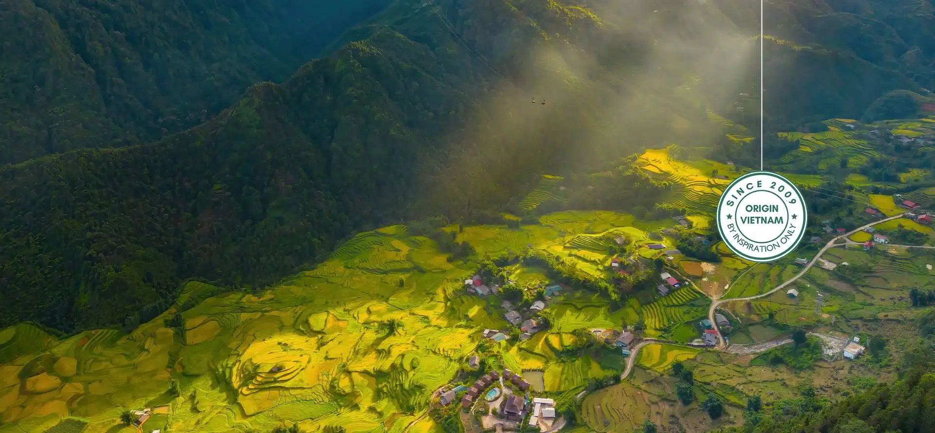 Photographer capturing terraced rice fields and misty mountains in Sapa